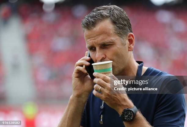 June 2018, Austria, Klagenfurt: Soccer international friendly, Austria vs Germany at the Woerthersee Stadium. Germany's Team manager on the phone....