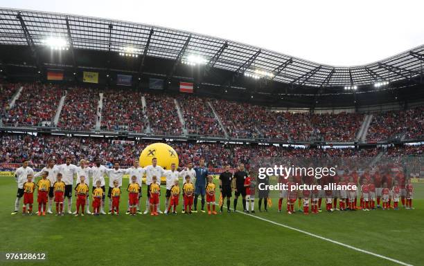June 2018, Austria, Klagenfurt: Soccer international friendly, Austria vs Germany at the Woerthersee Stadium. The teams standing on the field for the...