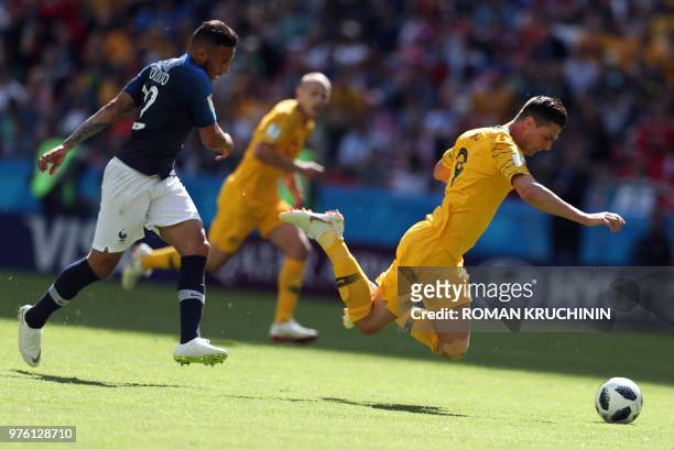 France's midfielder Corentin Tolisso tackles Australia's forward Tomi Juric during the Russia 2018 World Cup Group C football match between France...