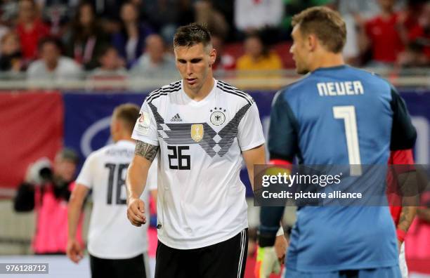 June 2018, Austria, Klagenfurt: Soccer international friendly, Austria vs Germany at the Woerthersee Stadium. Germany's Niklas Suele and Goalkeeper...