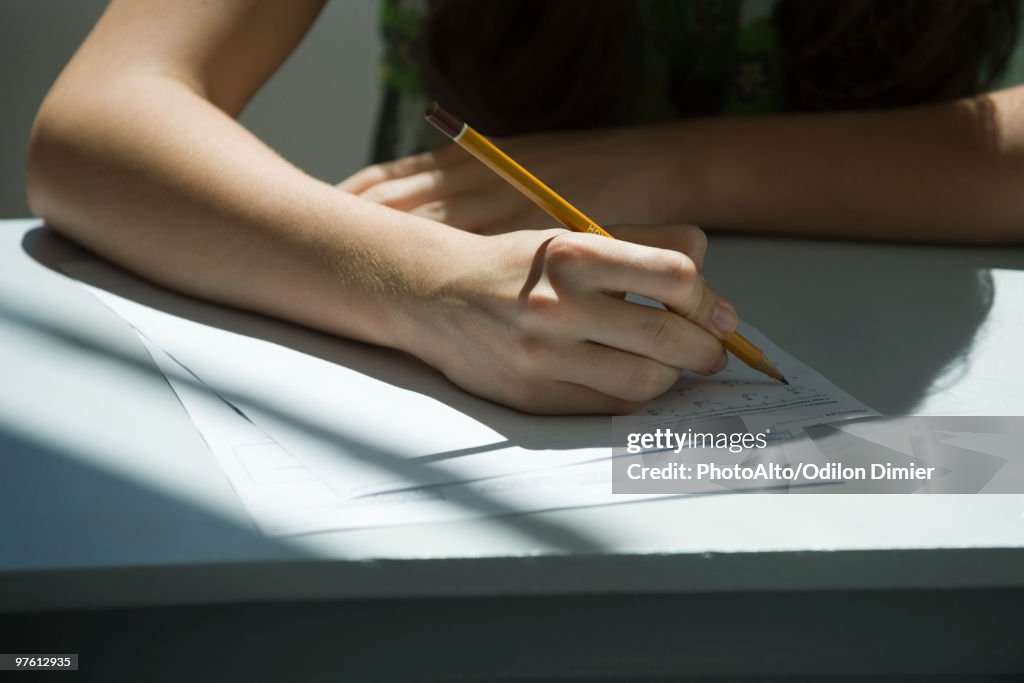 Student taking math quiz, cropped