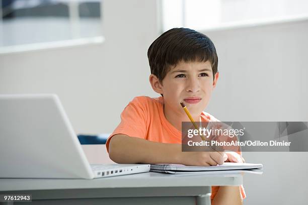 elementary school student taking notes in class - squinting stock pictures, royalty-free photos & images