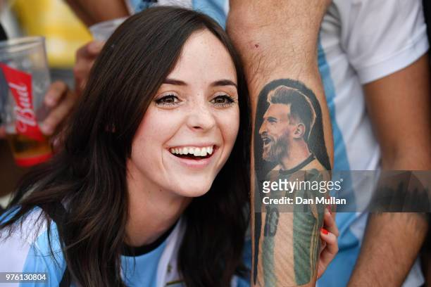 An Argentina fan poses with a fellow fans tattoo of Lionel Messi of Argentina prior to the 2018 FIFA World Cup Russia group D match between Argentina...