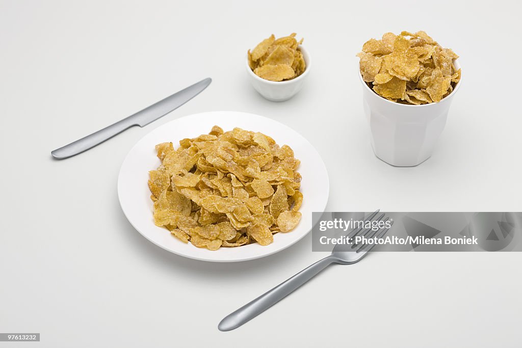Food concept, cereal filling plate, bowl and glass