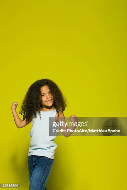 little girl flexing muscles, portrait - girl standing stock pictures, royalty-free photos & images
