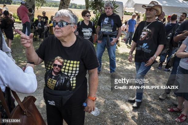 Johnny Hallyday fans attend the inauguration of a statue of the late French rocker installed in the Southeastern French village of Viviers, where the...