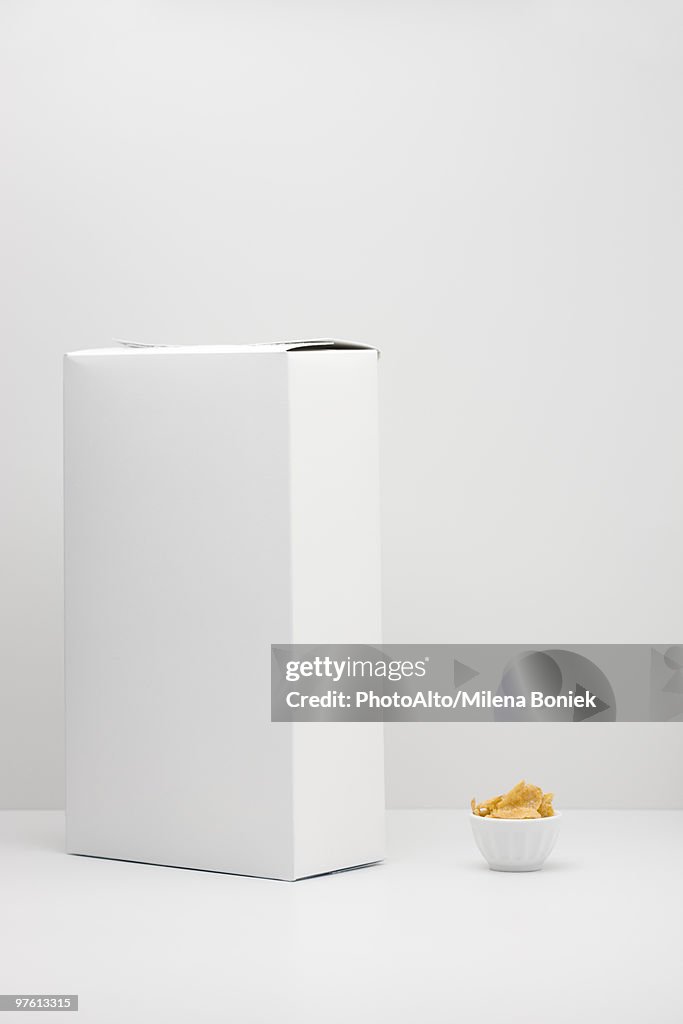 White cereal box and small bowl of cereal