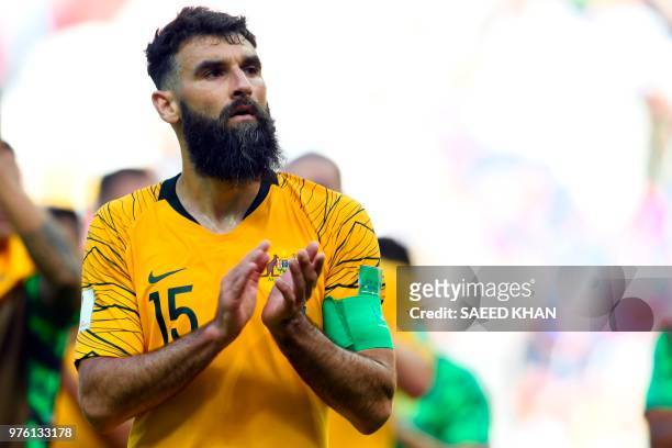 Australia's midfielder Mile Jedinak applaud their fans after being defeated by France at the end of the Russia 2018 World Cup Group C football match...