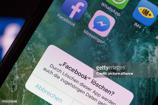 June 2018, Germany, Berlin: The question 'Delete Facebook?' appears on the screen of a smartphone in German. Photo: Fabian Sommer/dpa