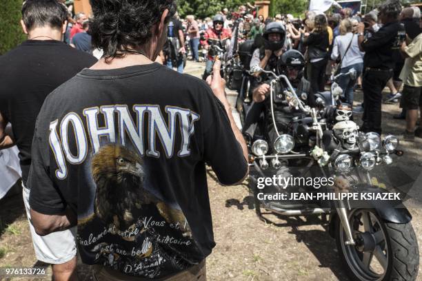 Fans attend the inauguration of a statue of the late French rocker Johnny Hallyday installed in the Southeastern French village of Viviers, where the...