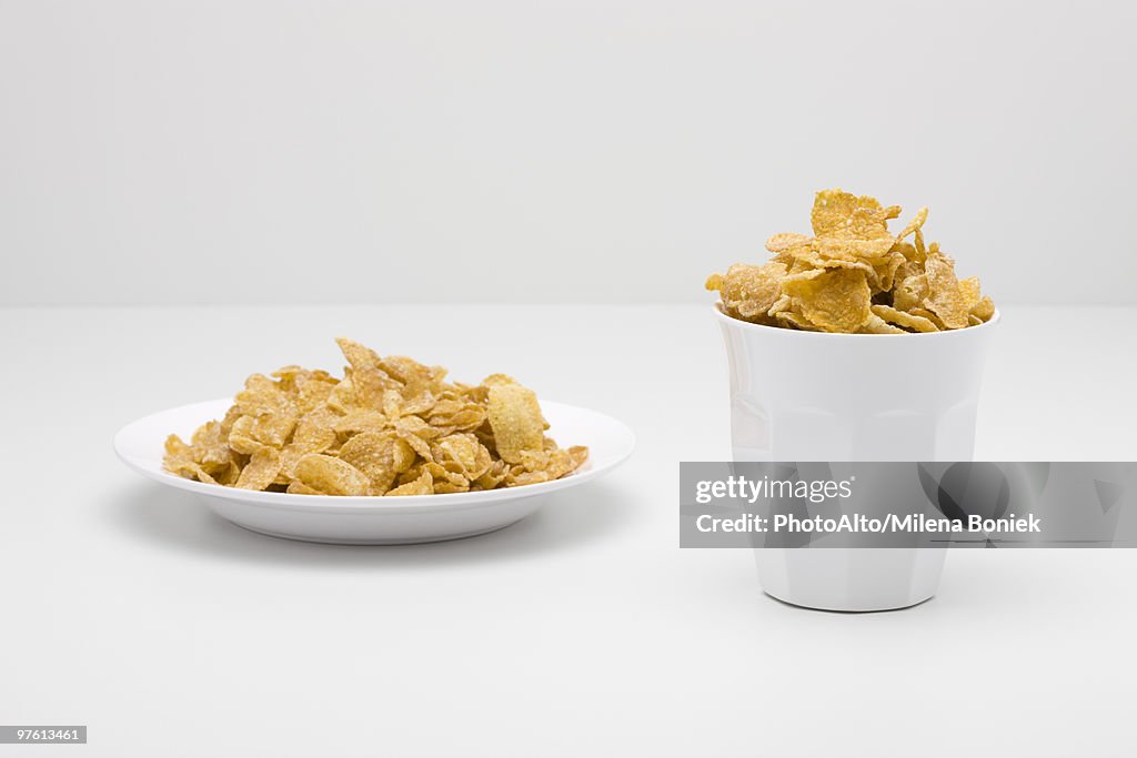 Food concept, cereal filling bowl and glass