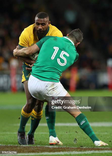 Marika Koroibete of the Wallabies is tackled by Rob Kearney of Ireland during the International test match between the Australian Wallabies and...