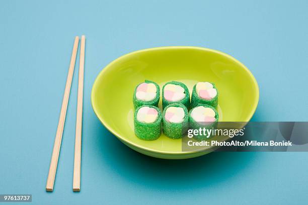 food concept, candy rolled to look like maki rolls - maki sushi stock pictures, royalty-free photos & images