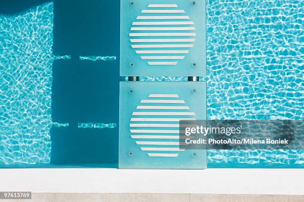 stepping stones crossing swimming pool, overhead view - stepping stone top view stock pictures, royalty-free photos & images