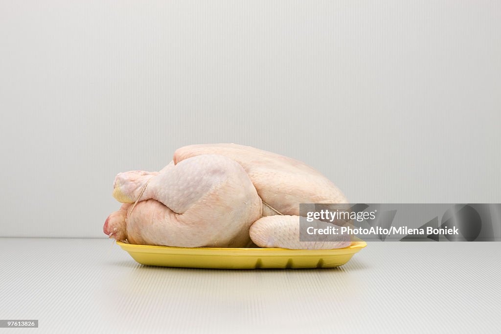 Food concept, raw whole chicken on polystyrene tray