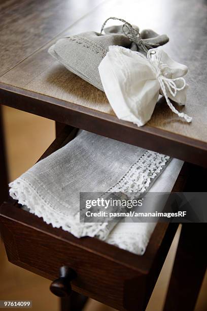 hemp products in a wooden desk - drawstring bag stock pictures, royalty-free photos & images