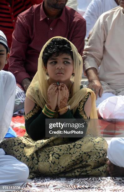 Indian Muslim child offering the Eid al Fitr prayers at Red Road in Kolkata, India on Saturday, 16th June , 2018. Muslims around the world are...