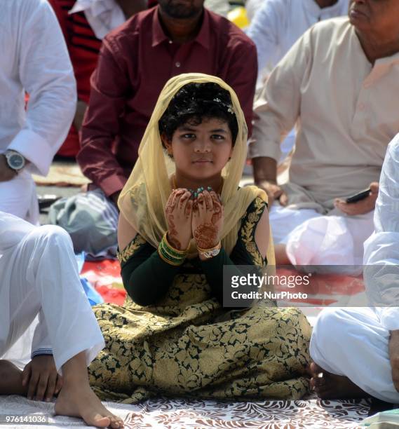 Indian Muslim child offering the Eid al Fitr prayers at Red Road in Kolkata, India on Saturday, 16th June , 2018. Muslims around the world are...