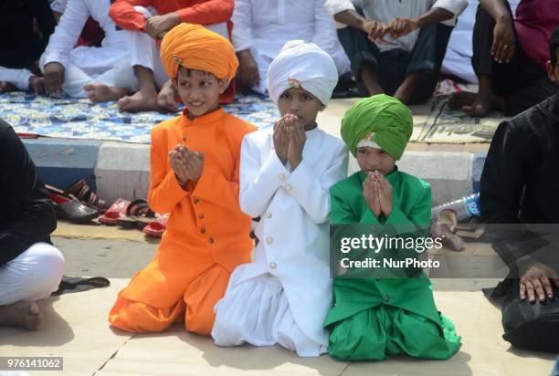 Indian Muslim child offering the Eid al Fitr prayers at Red Road in Kolkata, India on Saturday, 16th June , 2018. Muslims around the world are...