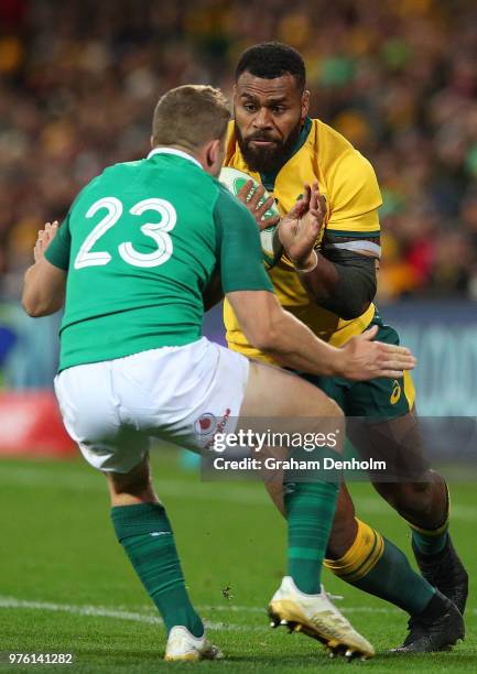 Samu Kerevi of the Wallabies runs at his opponent during the International test match between the Australian Wallabies and Ireland at AAMI Park on...