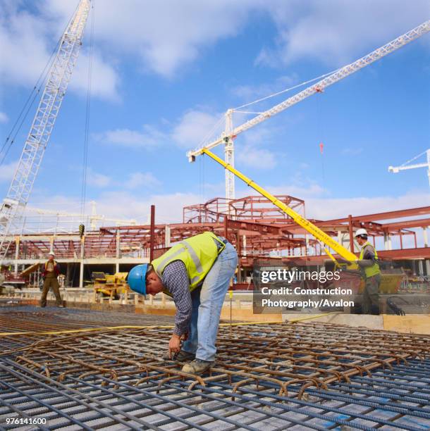 Worker fixing steel reinforcement on construction of Bluewater Shopping Centre Kent.