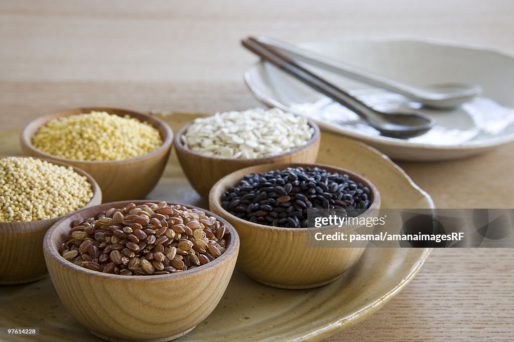 Wooden bowls of different grains
