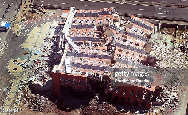 Story apartment building is seen laying on its side after it collapsed during the February 27th earthquake March 10, 2010 in Concepcion, Chile. Food,...