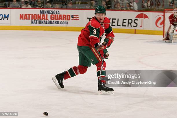 Marek Zidlicky of the Minnesota Wild delivers a pass against the Calgary Flames during the game at the Xcel Energy Center on March 7, 2010 in Saint...