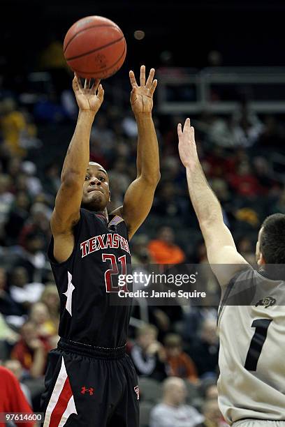 John Roberson of the Texas Tech Red Raiders shoots the ball over Nate Tomlinson of the Colorado Buffaloes in the second half during the first round...