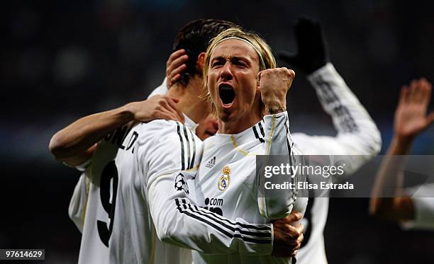 Cristiano Ronaldo of Real Madrid celebrates with his teammate Guti after scoring during the UEFA Champions League round of sixteen, second leg match...