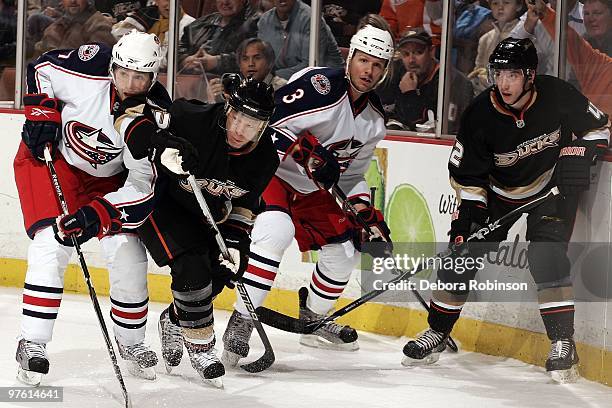 Andrew Murray and Marc Methot of the Columbus Blue Jackets defend behind the net against Brett Festerling and Dan Sexton of the Anaheim Ducks during...