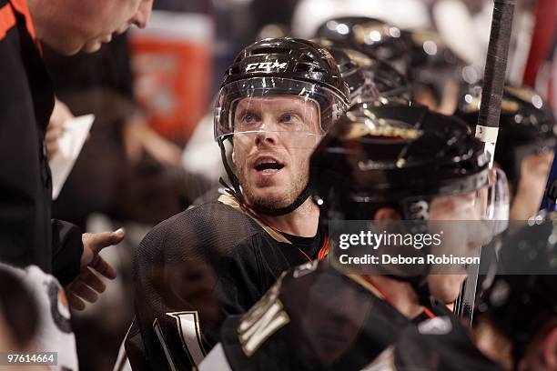 Saku Koivu of the Anaheim Ducks talks to a trainer on the bench during the game against the Columbus Blue Jackets on March 9, 2010 at Honda Center in...