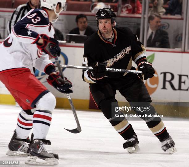 Maksim Mayorov of the Columbus Blue Jackets defends against Aaron Ward of the Anaheim Ducks during the game on March 9, 2010 at Honda Center in...