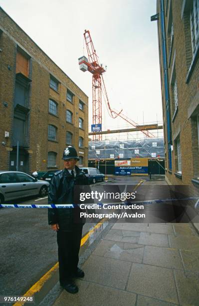 Tower Crane accident in South London, The crumpled jib hangs precariously over the building site.