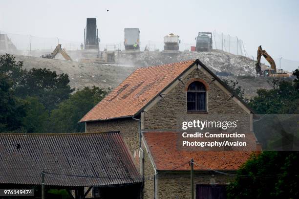 Vert-le Grand, Essonne, France, lorries unloading rubbish at landfill site.