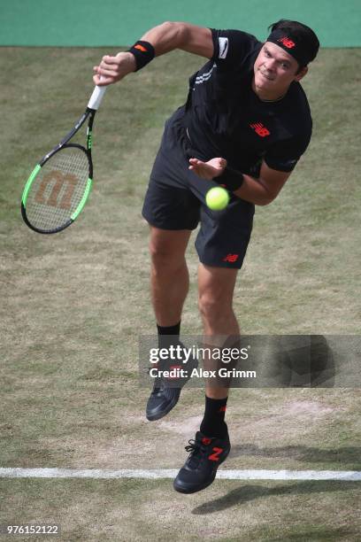 Milos Raonic of Canada serves the ball to Lucas Pouille of France during day 6 of the Mercedes Cup at Tennisclub Weissenhof on June 16, 2018 in...