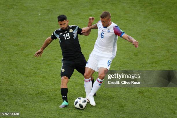 Serigo Aguero of Argentina and Ragnar Sigurdsson of Iceland battle for possession during the 2018 FIFA World Cup Russia group D match between...