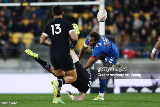Benjamin Fall of France collides with Jordie Barrett of the All Blacks competing for a high ball during the International Test match between the New...