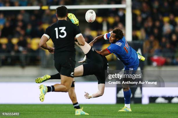 Benjamin Fall of France collides with Jordie Barrett of the All Blacks competing for a high ball during the International Test match between the New...