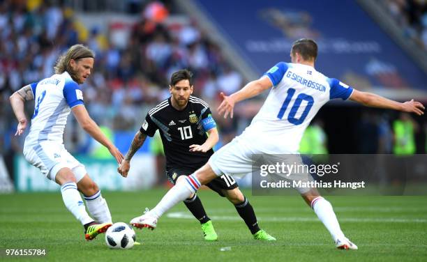 Lionel Messi of Argentina is challenged by Gylfi Sigurdsson and Birkir Bjarnason of Iceland during the 2018 FIFA World Cup Russia group D match...