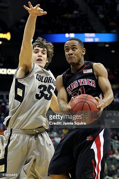 John Roberson of the Texas Tech Red Raiders goes up for a shot against Keegan Hornbuckle of the Colorado Buffaloes in the second half during the...
