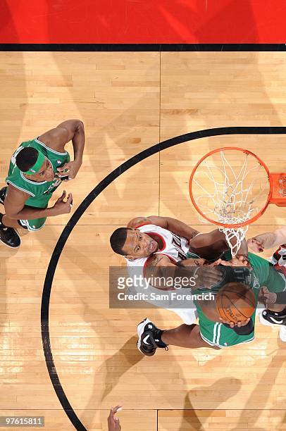 Marcus Camby of the Portland Trail Blazers blocks a shot by Glen Davis of the Boston Celtics during the game at The Rose Garden on February 19, 2010...
