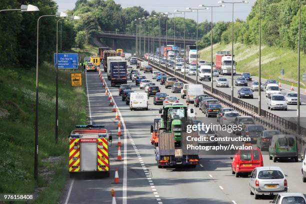 Fire engine using hard shoulder on M1 J25 to J28 widening project, England, UK.