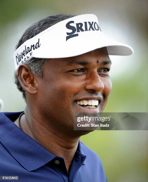 Vijay Singh of Fiji smiles on the practice range during practice for the World Golf Championships-CA Championship at Doral Golf Resort and Spa on...