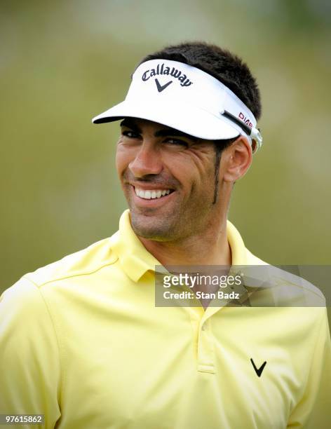 Alvaro Quiros of Spain smiles on the practice range during practice for the World Golf Championships-CA Championship at Doral Golf Resort and Spa on...