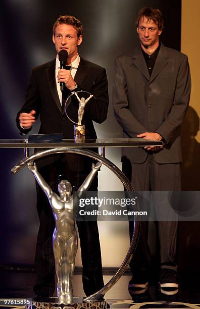 Driver Jenson Button on stage with his award for "Laureus Breakthrough of the Year" in the Awards room and Tony Hawk during the Laureus World Sports...