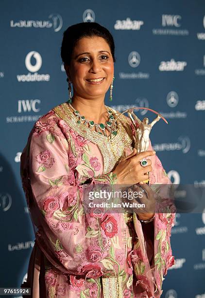 Nawal El Moutawakel with her Lifetime Achievement Award poses in the Awards room during the Laureus World Sports Awards 2010 at Emirates Palace Hotel...
