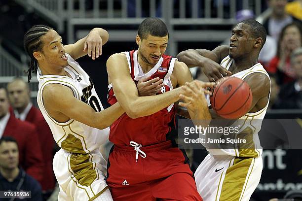 Ryan Anderson of the Nebraska Cornhuskers is double-teammed by Mike Dixon Jr. #10 and J.T. Tiller of the Missouri Tigers in the first half during the...