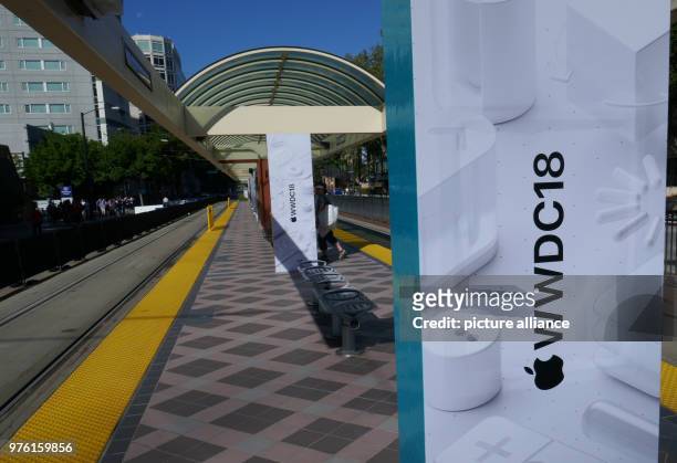 June 2018, San Jose, USA: The logo of the Apple Worldwide Developers Conference 2018 on the railway track of the Metra-Station of the McEnery...