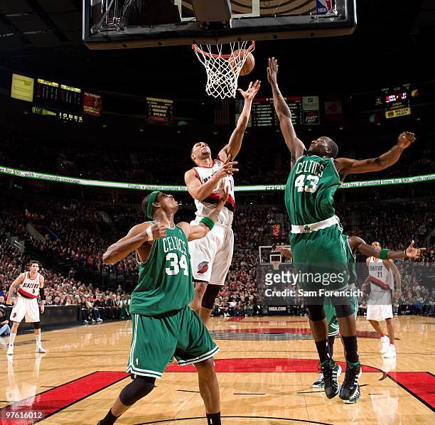 Brandon Roy of the Portland Trail Blazers shoots a layup against Paul Pierce and Kendrick Perkins of the Boston Celtics during the game at The Rose...